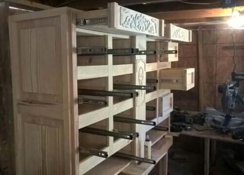 Dresser carcass with drawer runners being fitted