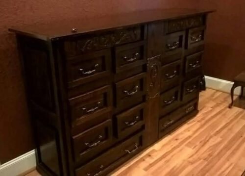 Finished dark stained dresser in a room