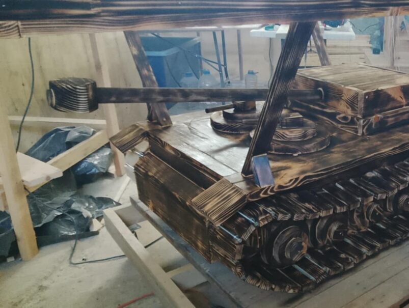 Table built on a tank running gear base